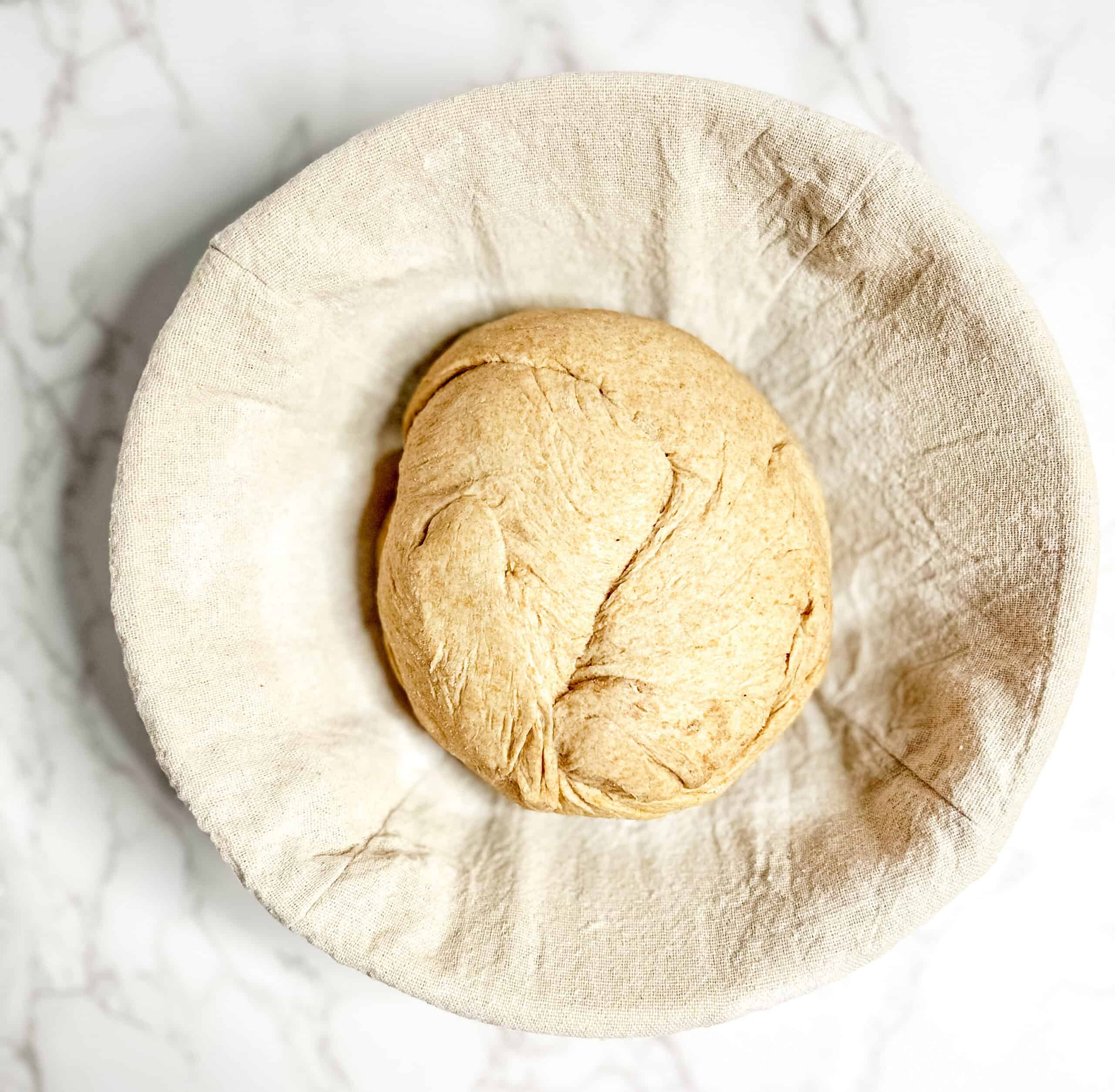 Sourdough shaped and put in a lined banneton for the refrigerator rest.