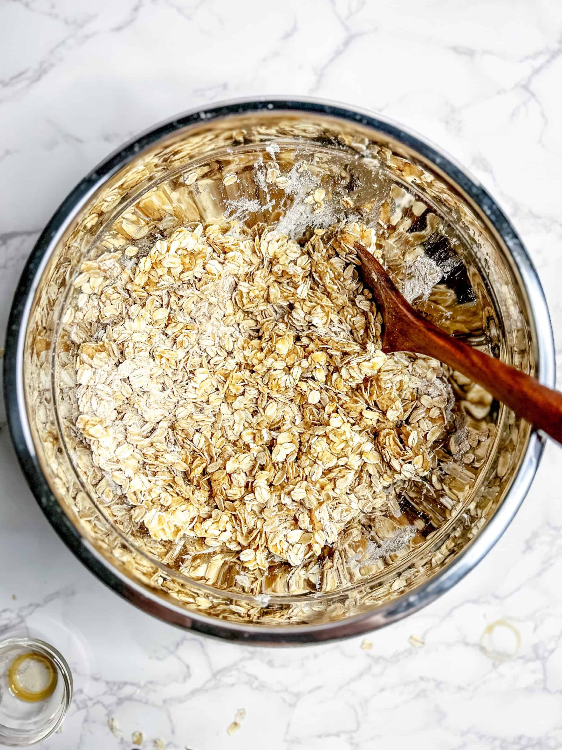 Combining the wet and dry ingredients in the same bowl