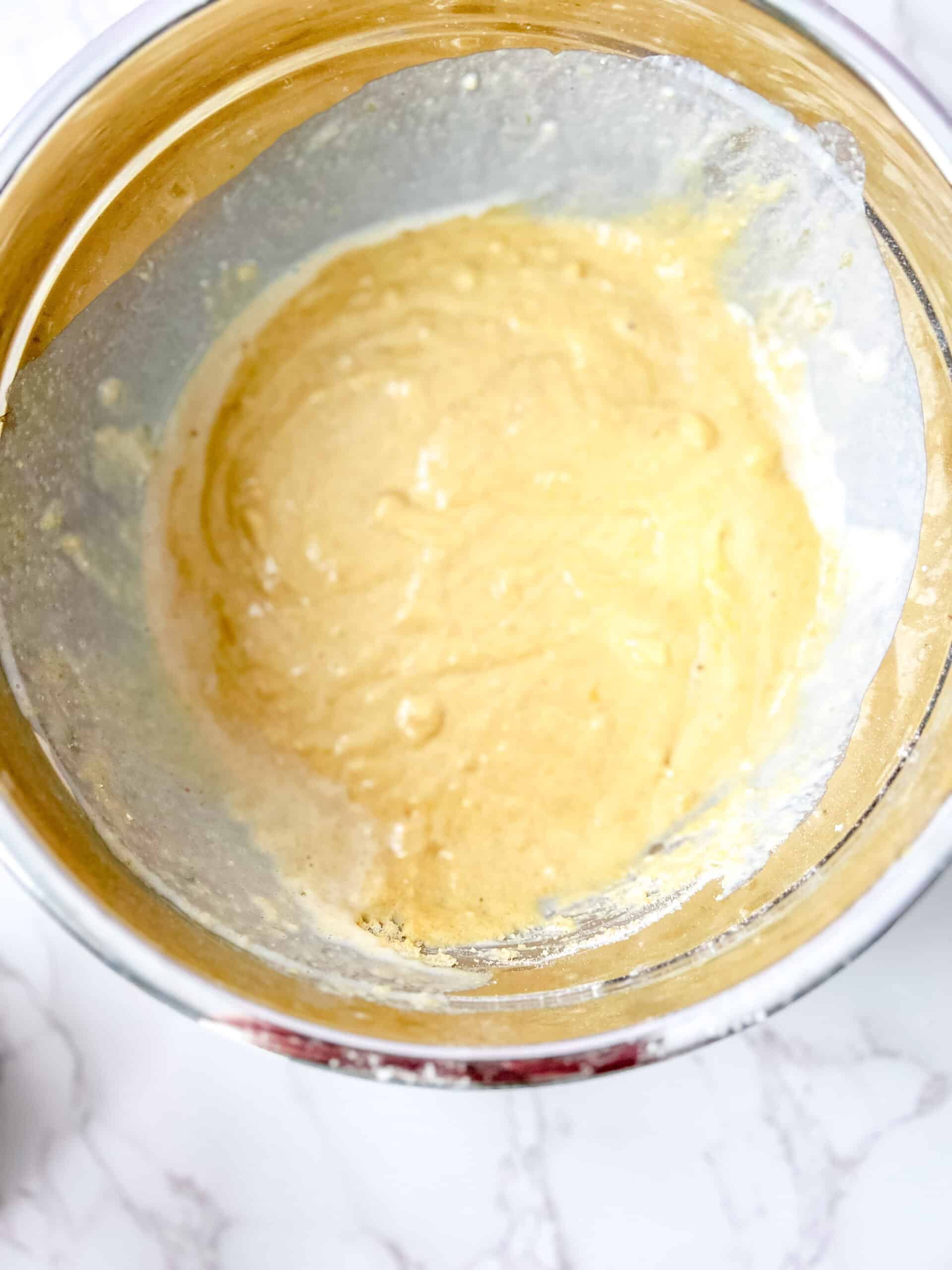 Wet and dry ingredients mixed together to form the cornbread batter